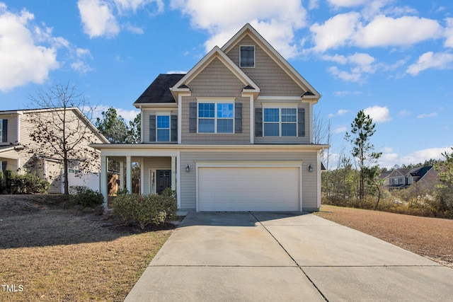 view of front of house with a garage and concrete driveway