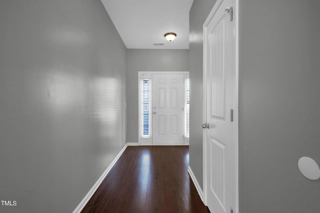 entrance foyer with visible vents, baseboards, and dark wood-style flooring