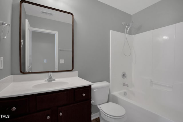 bathroom with toilet, visible vents, bathing tub / shower combination, and vanity