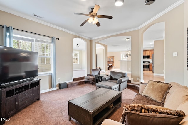 living room with arched walkways, ornamental molding, light carpet, and visible vents