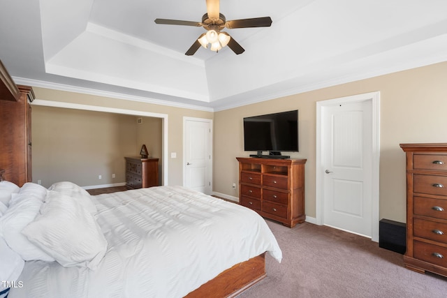 bedroom featuring ceiling fan, baseboards, a raised ceiling, and light colored carpet