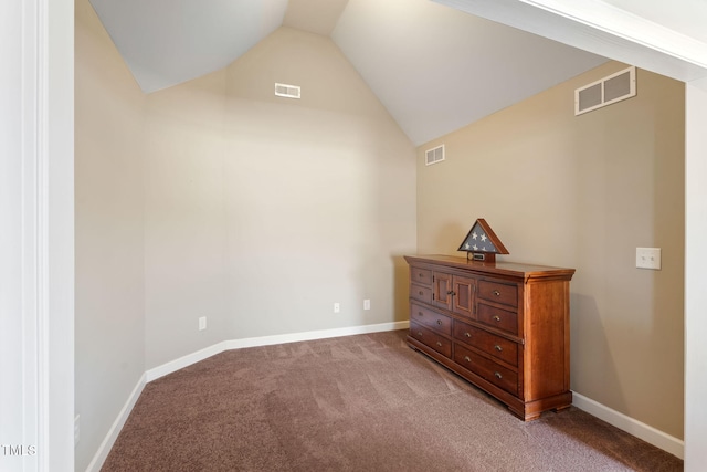 bedroom with vaulted ceiling, light carpet, and visible vents