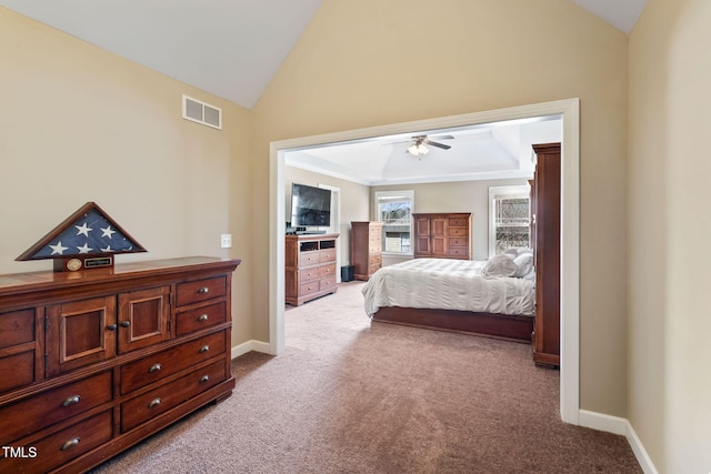 bedroom with carpet floors, lofted ceiling, visible vents, and baseboards