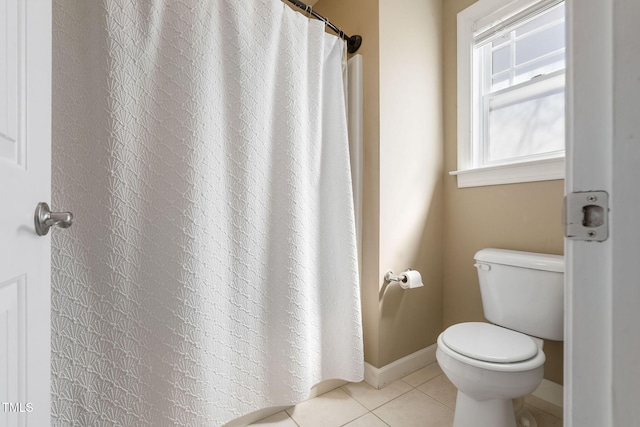 full bathroom featuring toilet, baseboards, and tile patterned floors