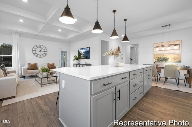 kitchen with dark wood-style flooring, coffered ceiling, open floor plan, beam ceiling, and a center island