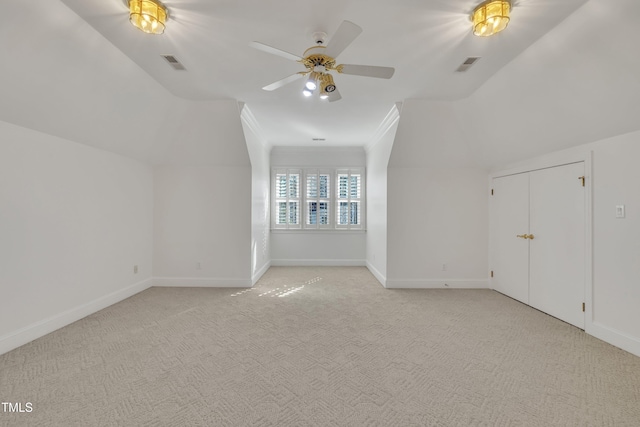 bonus room featuring visible vents, light carpet, and baseboards