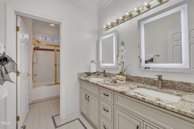 bathroom with double vanity, tile patterned flooring, crown molding, and a sink