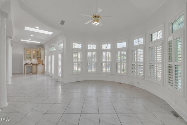 interior space featuring plenty of natural light, visible vents, and crown molding