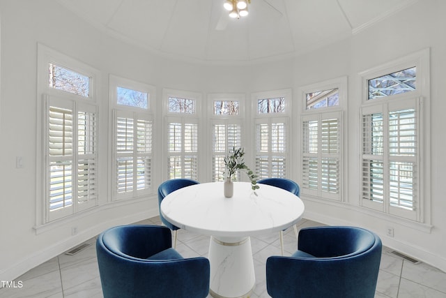 dining area featuring ornamental molding, visible vents, and plenty of natural light