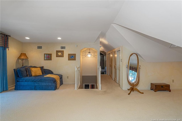 living area featuring carpet floors, visible vents, and recessed lighting