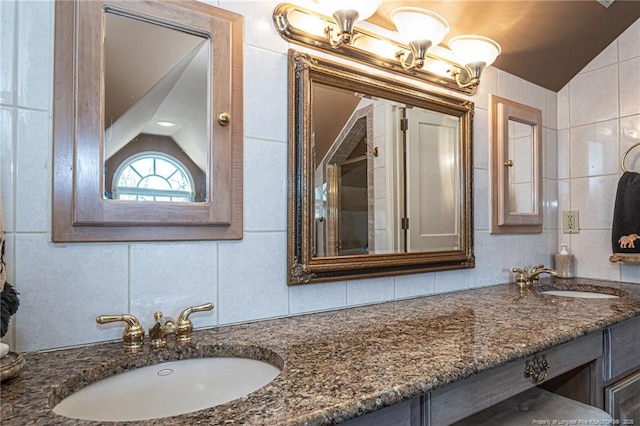 bathroom with a sink, tile walls, and decorative backsplash