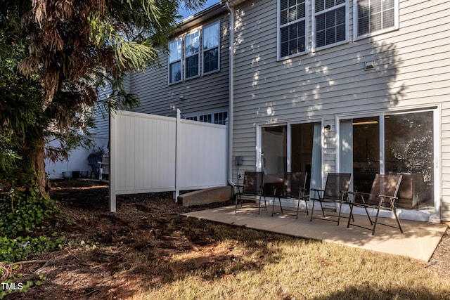 rear view of property featuring a patio