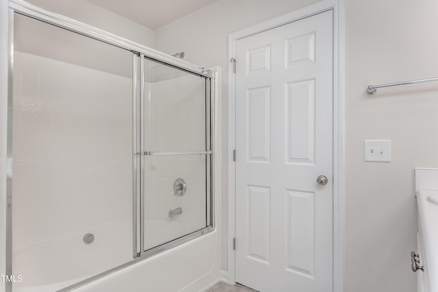 full bathroom featuring shower / bath combination with glass door