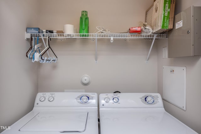 clothes washing area with laundry area and separate washer and dryer