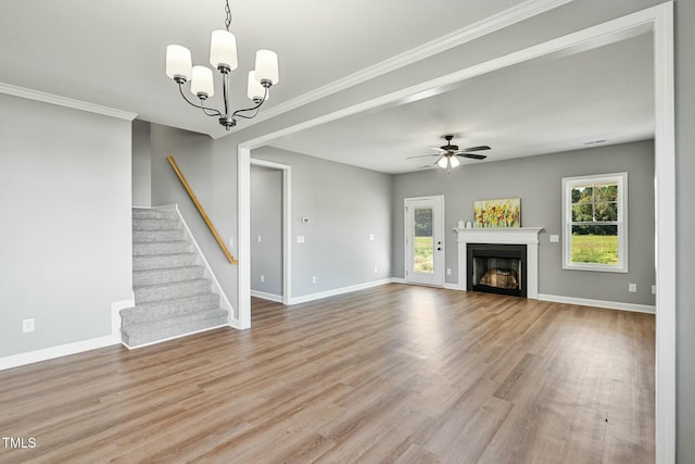 unfurnished living room with stairs, a fireplace, baseboards, and wood finished floors