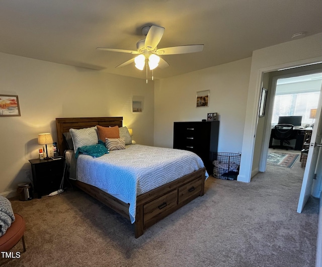 carpeted bedroom featuring baseboards and a ceiling fan