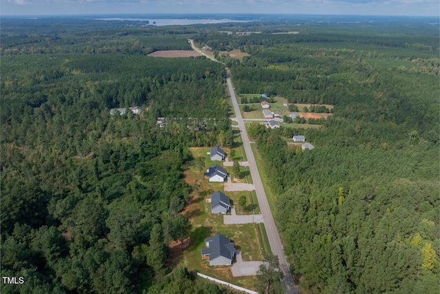 bird's eye view featuring a wooded view