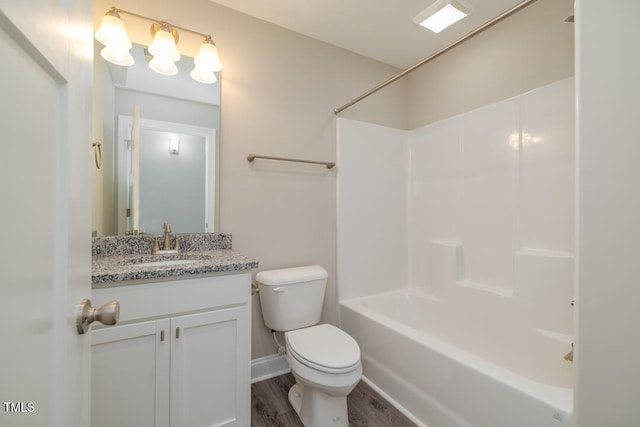 full bath featuring shower / washtub combination, vanity, toilet, and wood finished floors