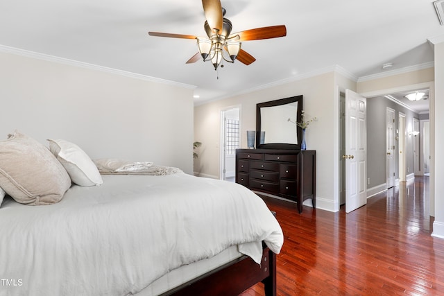 bedroom with ornamental molding, a ceiling fan, baseboards, and wood finished floors