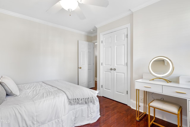 bedroom featuring crown molding, baseboards, ceiling fan, and wood finished floors