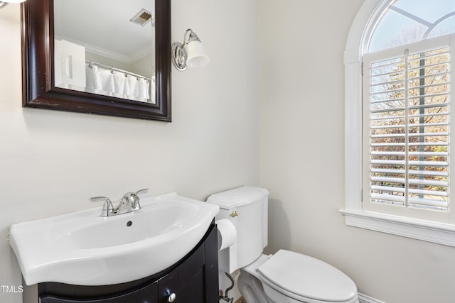 bathroom featuring toilet, visible vents, and vanity