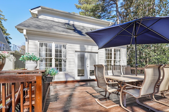 wooden deck with outdoor dining area