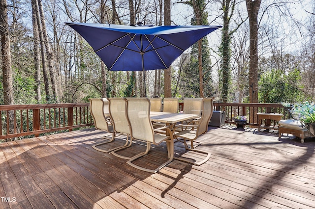 deck with outdoor dining area