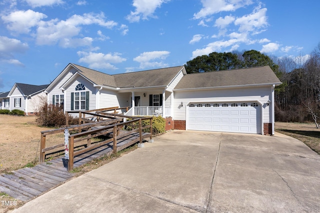 ranch-style home featuring driveway, covered porch, and an attached garage