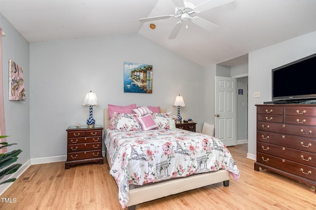 bedroom with visible vents, baseboards, ceiling fan, wood finished floors, and vaulted ceiling