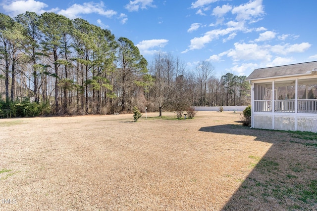 view of yard with a sunroom