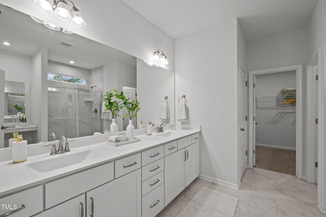 full bathroom with double vanity, a stall shower, a sink, and visible vents