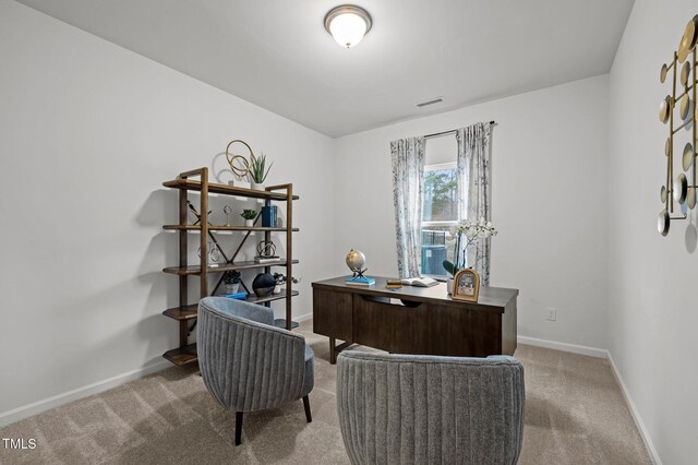 home office with carpet floors, baseboards, and visible vents