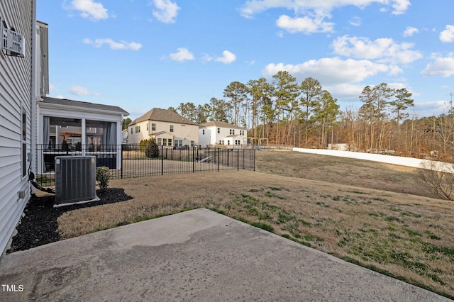 view of yard with a patio, cooling unit, and fence