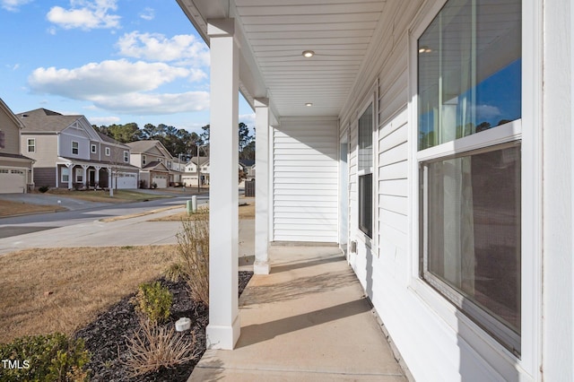 view of patio with a residential view and covered porch