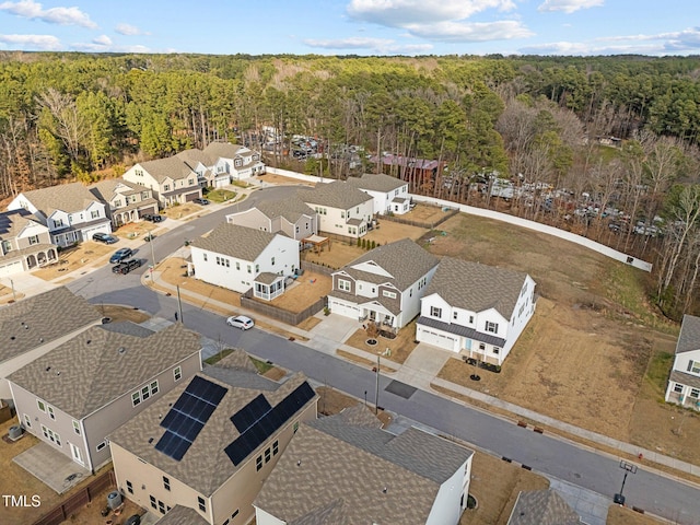 aerial view featuring a residential view and a view of trees