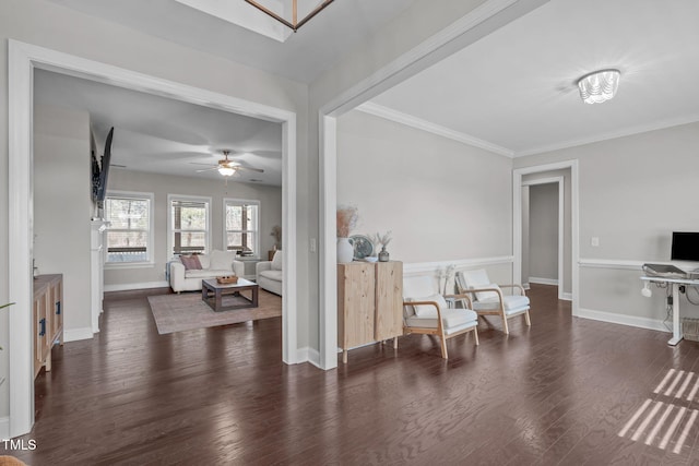 living area featuring crown molding, ceiling fan, wood finished floors, and baseboards