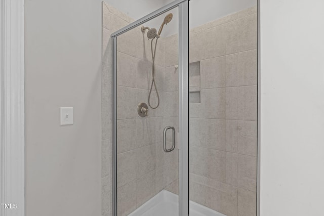 bathroom with a stall shower