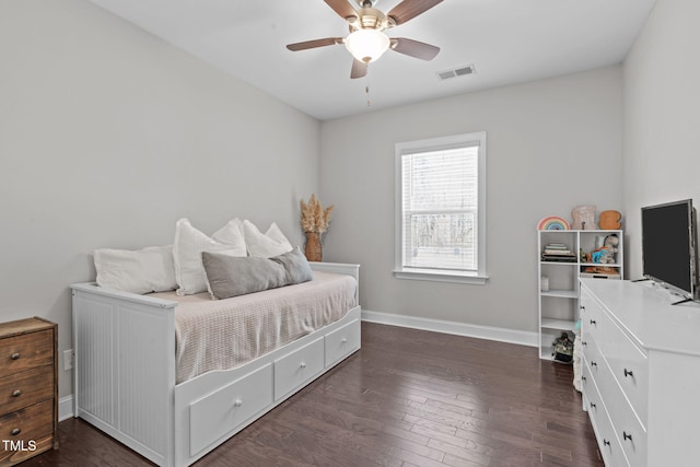 bedroom with dark wood-style floors, baseboards, visible vents, and a ceiling fan