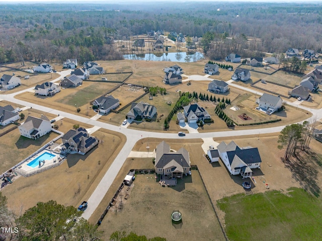 bird's eye view with a residential view and a wooded view