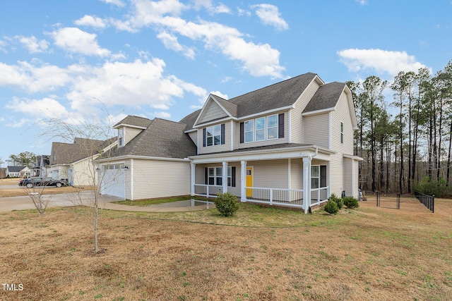 view of front of home with covered porch, an attached garage, a front lawn, and concrete driveway