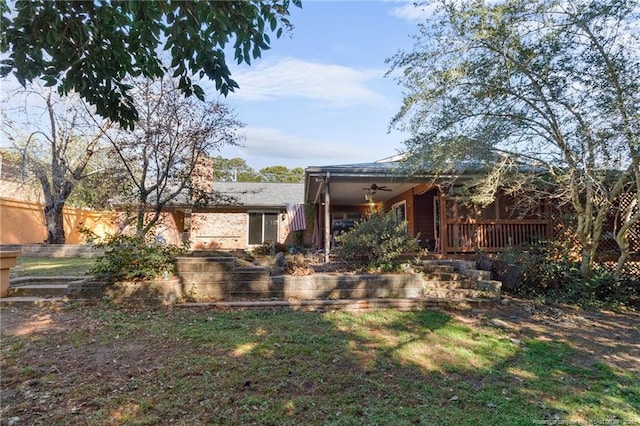 exterior space with ceiling fan