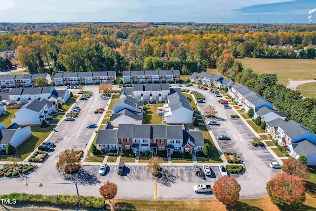 bird's eye view with a residential view and a wooded view