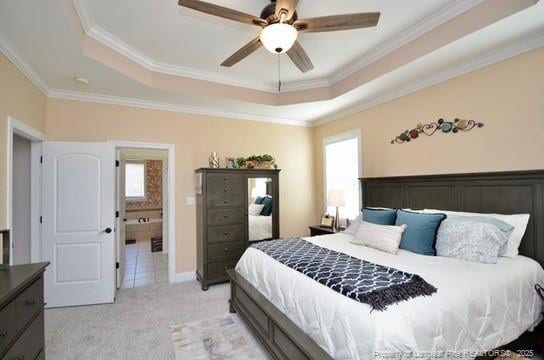 bedroom featuring a raised ceiling, light colored carpet, and crown molding