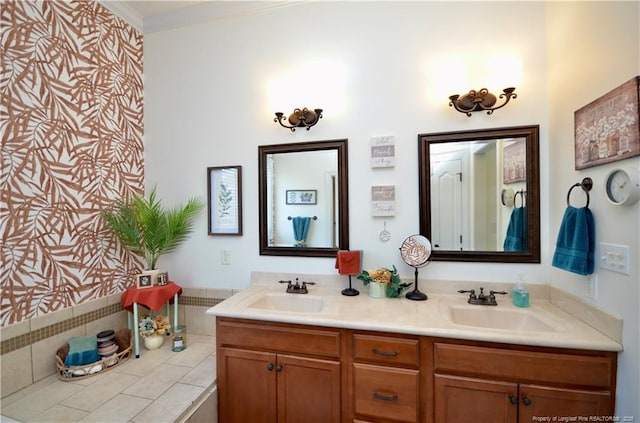 bathroom with double vanity, crown molding, and a sink