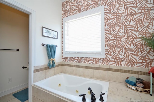 bathroom featuring tile patterned floors, baseboards, a tub with jets, and wallpapered walls