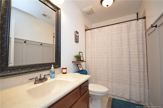 bathroom with tile patterned flooring, visible vents, vanity, and toilet