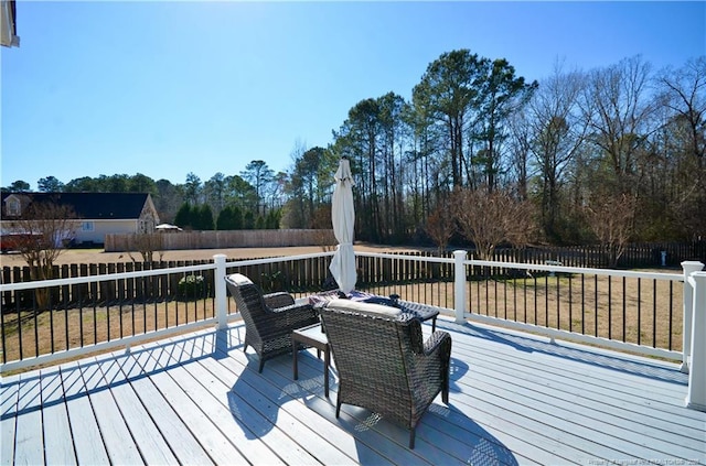 wooden deck with fence private yard and a lawn