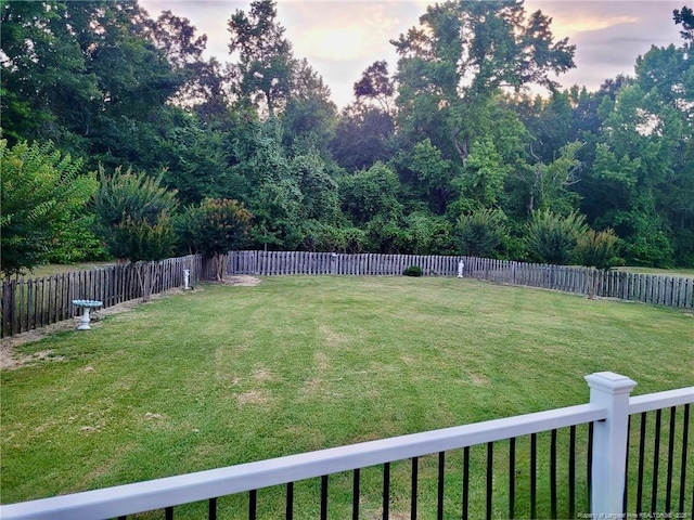 view of yard with a fenced backyard