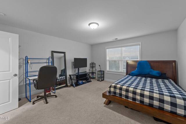 bedroom with carpet, visible vents, and baseboards