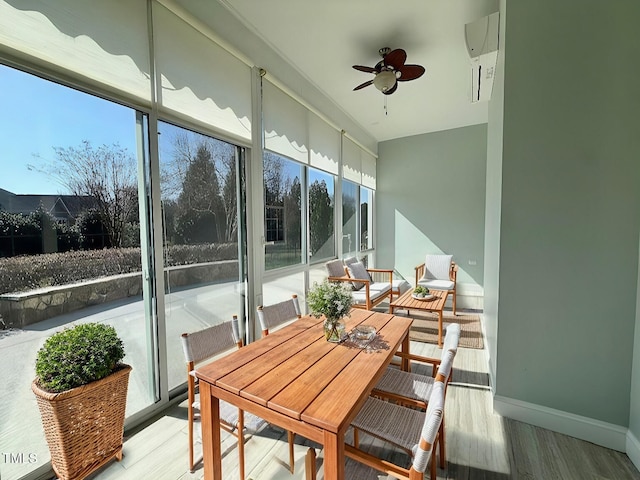 sunroom / solarium featuring ceiling fan